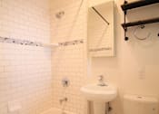 Thumbnail 58 of 59 - a white bathroom with a toilet sink and tub