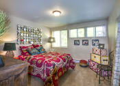 Thumbnail 14 of 28 - a bedroom with a bed and a window