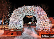Thumbnail 15 of 17 - a tunnel of christmas lights at night