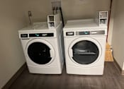 Thumbnail 1 of 6 - two washing machines next to each other in a room