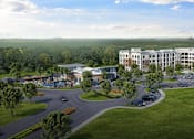 Thumbnail 1 of 4 - A large building complex with a parking lot in front at Manor East Apartments, Manor, TX, 78653 