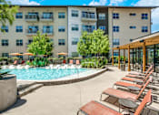 Thumbnail 15 of 19 - Pool With Relaxing Chairs at Infinity on Yorktown, Dallas, TX 75208