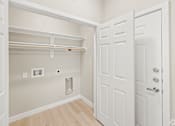 Thumbnail 14 of 19 - a bedroom with a closet and a door to a bathroom at Creekside at Grand Prairie, Grand Prairie, TX