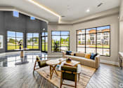 Thumbnail 7 of 19 - a living room with a couch and a table at Creekside at Grand Prairie, Grand Prairie, TX