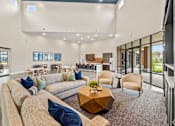 Thumbnail 8 of 19 - the preserve at ballantyne commons living room with couches and tables at Creekside at Grand Prairie, Grand Prairie, 75052