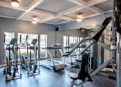 Thumbnail 7 of 30 - a gym with treadmills and other exercise equipment at Infinity on the Mark, Dallas, Texas