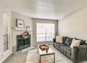 Thumbnail 27 of 30 - Living Room with Fireplace at Infinity on the Mark, Dallas, Texas