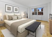 Thumbnail 8 of 12 - A bedroom with a large bed and a window overlooking a cityscape at The Caldwell Apartments, New York, NY