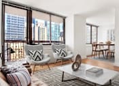 Thumbnail 13 of 17 - A modern living room with a view of the city at The Ellington Apartments, New York, New York