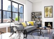 Thumbnail 6 of 18 - A living room with a grey couch and a fireplace.at Sutton Collection, New York