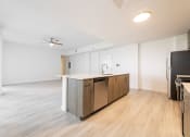 Thumbnail 7 of 41 - Solaris Apartment Homes_LivingRoomKitchen