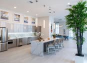 Thumbnail 4 of 36 - the lobby or reception area of a building with plants