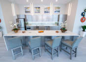 Thumbnail 5 of 36 - a kitchen with a large island and chairs
