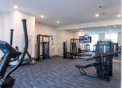 Thumbnail 22 of 36 - a gym with weights and other exercise equipment in a building