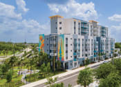 Thumbnail 1 of 41 - a large building with colorful painting on the side of it