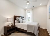 Thumbnail 14 of 16 - a bedroom with a bed and a window