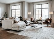 Thumbnail 1 of 52 - A living room with a white sofa, a wooden coffee table, and a rug on the floor.
