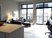 Thumbnail 13 of 52 - A modern living room with a large window and a view of the city. at The Pearl, Fort Wayne, IN, 46802