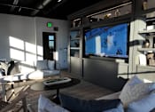 Thumbnail 34 of 52 - Community Lounge with a flat screen TV and comfortable seating.