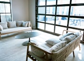 Thumbnail 35 of 52 - Community room with a couch, chair, and table at The Pearl, Fort Wayne