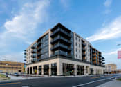 Thumbnail 51 of 52 - A large building with a sign that says Peregrine Bank.