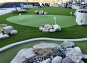 Thumbnail 43 of 52 - A miniature golf course with a white flag on the green. at The Pearl, Fort Wayne, 46802