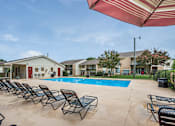 Thumbnail 4 of 18 - Spacious, landscaped outdoor terrace with lush seating, grills and a fire pit