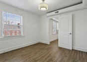 Thumbnail 15 of 34 - A room with a white door and a window with blinds at Shipyard Shores Apartments, Newport News, VA, 23607