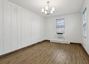 Thumbnail 20 of 34 - A room with wooden floors and white walls at Shipyard Shores Apartments, Virginia