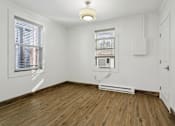 Thumbnail 25 of 34 - A room with a window and a radiator on the floor at Shipyard Shores Apartments, Newport News, Virginia