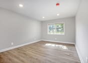 Thumbnail 7 of 15 - A room with a window and wooden flooring.at Palisades Apartments, Missouri