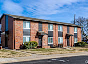 Thumbnail 3 of 20 - A red brick apartment building with a black roof. at Blacklark Apartments, Kansas City, 66101