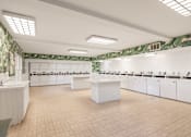 Thumbnail 39 of 42 - A spacious community laundry room with green floral wallpaper at The Aspens South Coast, California, 92504