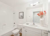 Thumbnail 19 of 30 - a bathroom with a sink and a toilet and a bath tub