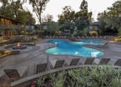 Thumbnail 19 of 19 - a large swimming pool with chairs around it