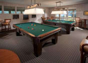 Thumbnail 15 of 19 - a game room with two pool tables