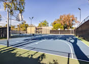 Thumbnail 32 of 42 - A basketball court with a blue surface and white lines at The Aspens South Coast, California, 92504