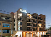 Thumbnail 83 of 88 - A building with a sign that says "BOULEVARD CENTER" is shown at dusk.