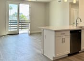 Thumbnail 18 of 88 - A modern kitchen with a dishwasher and a ceiling fan.