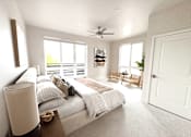 Thumbnail 6 of 88 - A bedroom with a large bed and a ceiling fan.