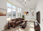 Thumbnail 6 of 35 - a living room with a couch and a coffee table