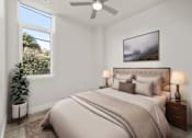 Thumbnail 11 of 35 - the guest bedroom of a modern home with a bed and a ceiling fan