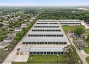 Thumbnail 3 of 11 - An aerial view of the Houston Premium Storage facility showing multiple buildings and main entrance..