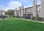 Thumbnail 12 of 35 - Building area viewat Royal Wildewood Manor Apartments, Clute
