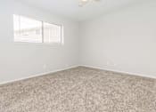 Thumbnail 12 of 26 - Carpeted Bedroom at Castlewood Apartments, Texas