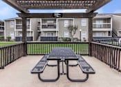 Thumbnail 13 of 35 - Outdoor area at Royal Wildewood Manor Apartments, Clute, TX