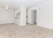 Thumbnail 15 of 26 - Carpeted Living Area at Castlewood Apartments, Clute, TX