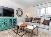 Thumbnail 27 of 35 - Living room at Royal Wildewood Manor Apartments, Clute, Texas
