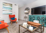 Thumbnail 28 of 35 - Living room with couch and tv at Royal Wildewood Manor Apartments, Clute, 77531
