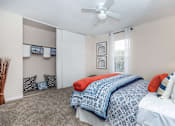 Thumbnail 32 of 35 - Bedroom with cozy bed and lampat Royal Wildewood Manor Apartments, Clute